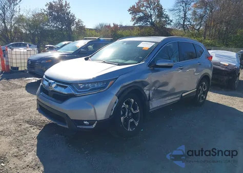 2018 Honda Cr-V Touring z USA, uszkodzony, nr VIN 7FARW2H94JE058771